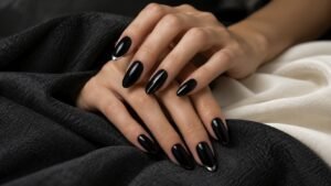 black with silver nails on almond-shaped nails